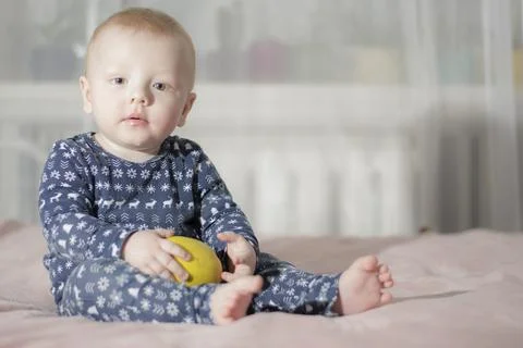 Baby with an apple Stock Photos