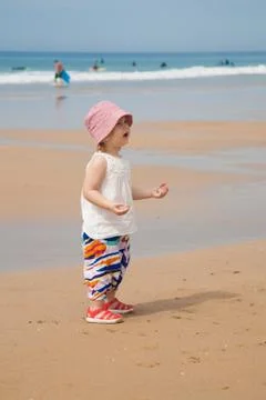 Baby at beach asking Stock-Fotos