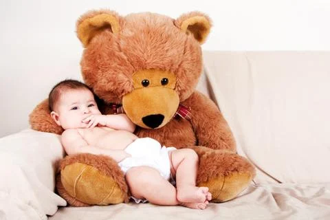 Baby with bear Stock Photos