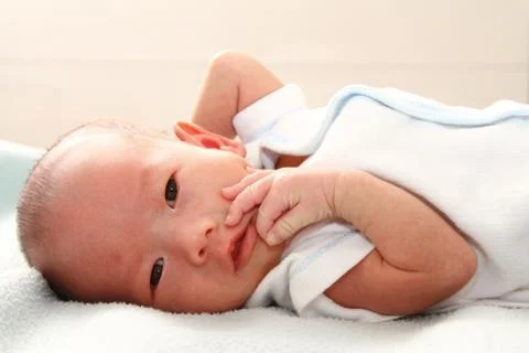 Baby on bed Stock Photos