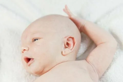 Baby in bed Stock Photos