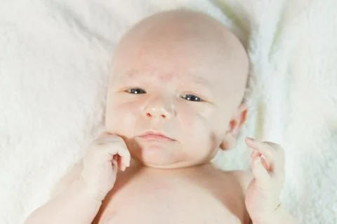 Baby in bed Stock Photos