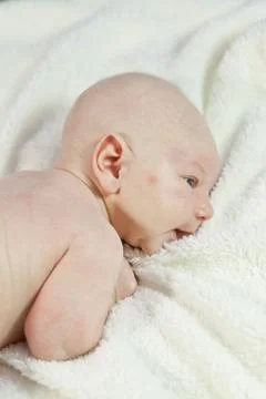 Baby in bed Stock Photos