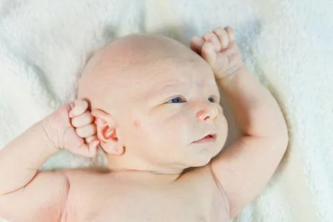 Baby in bed Stock Photos
