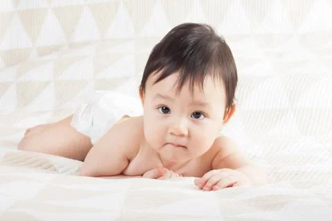 Baby on the bed Stock Photos