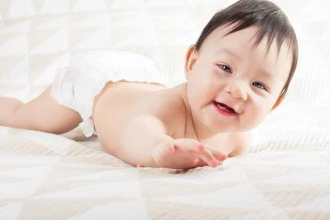Baby on the bed Stock Photos