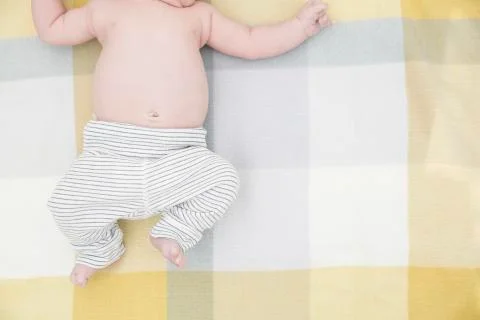 Baby on bed Stock Photos