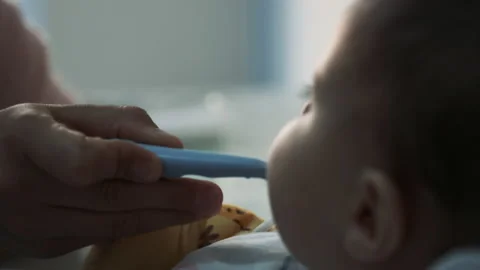 Baby Beginning the Complementary Food Process Stock Footage 221774661