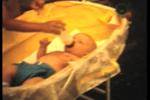 Baby being fed Stock Footage 24703194