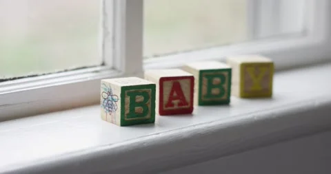 Baby Blocks sitting by a window Stock Footage 144519421