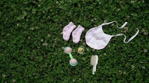 Baby booties, bib, rattle Stock Footage