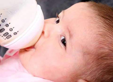 Baby bottle feeding Stock Photos