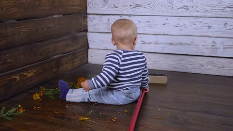 Baby boy and mop On the floor Slow motion Stock Footage 80253258