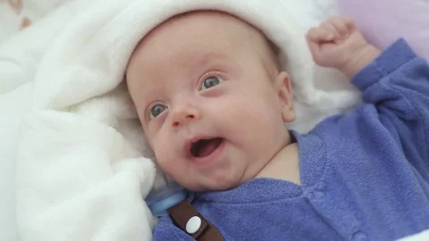 Baby boy in bed Stock Footage 80001594