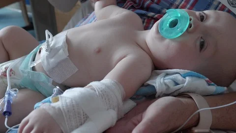 Baby Boy Being Held After Surgery Stock Footage 100239113