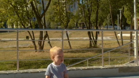Baby boy catching soap bubbles Stock-Footage 112608482