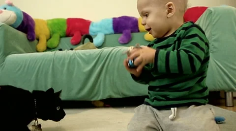 Baby boy with cat.FULL HD. slow motion Stock Footage 48976441