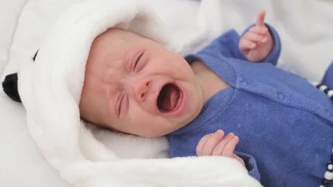 Baby boy crying in the crib Stock Footage 103532700