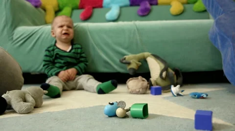 Baby boy is crying on the floor FULL HD tracking shot Stock Footage 48973266