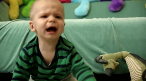 Baby boy is crying on the floor FULL HD tracking shot CLOSE Stock Footage 48973575