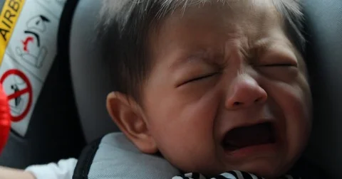 Baby boy crying not sitting in car seat Stock Footage 80467422