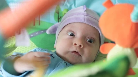 Baby boy on a developing rug Stock Footage 106194353