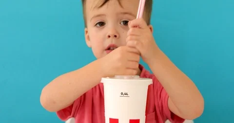Baby boy drinking milkshake Stock Footage 118710046