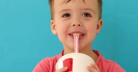 Baby boy drinking milkshake Video stock 118710491