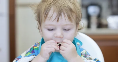 Baby boy eats spaghetti Stock Footage 119072834