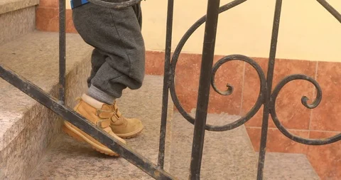 Baby boy going down steps Video stock 90273482