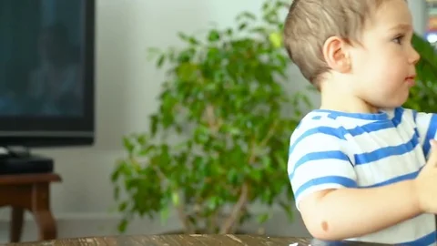 Baby boy having fun while playing with plasticine Stock Footage 84095889