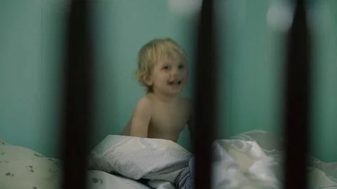 Baby boy is jumping in the bed Stock Footage 74680947