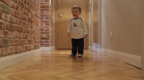 Baby boy makes first steps Stock Footage 44325907