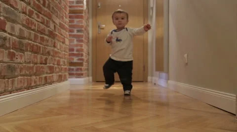 Baby boy makes first steps Stock Footage 44326214