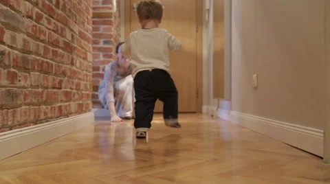 Baby boy makes first steps Stock Footage 44326395