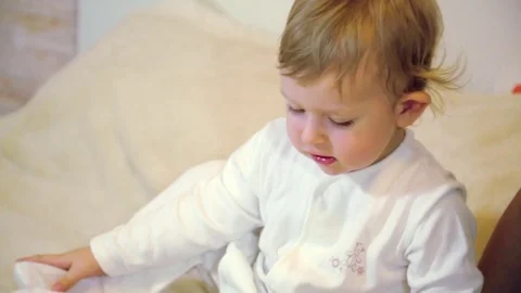 Baby boy with mom playing on a tablet Stock Footage 73147312