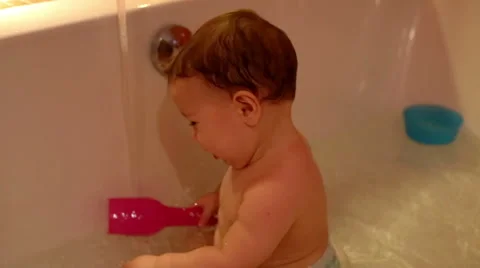 Baby boy is play in a bath  Video stock 61925035