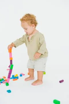 Baby boy playing with blocks Stock Photos