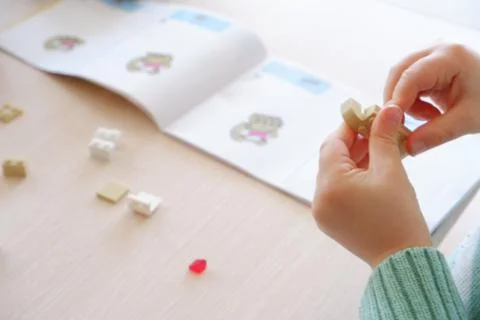 Baby boy playing with structure blocks in home Stock Photos