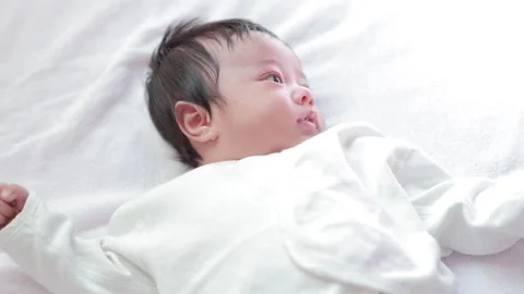 The baby boy sleeping on the bed Stock Footage 327847691