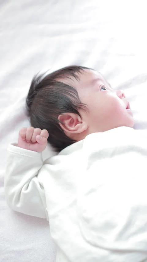 The baby boy sleeping on the bed Stock Footage 327847692