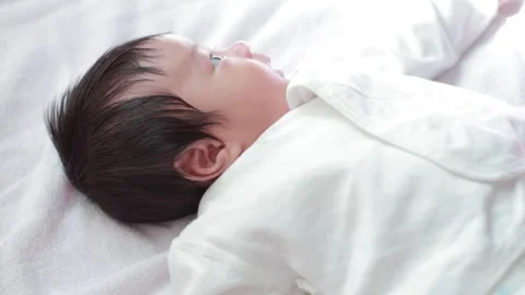 The baby boy sleeping on the bed Stock Footage 327847708