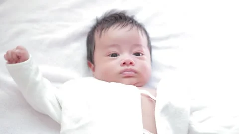 The baby boy sleeping on the bed Stock Footage 327847710