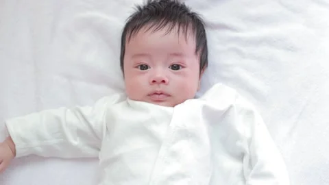 The baby boy sleeping on the bed Stock Footage 327847726