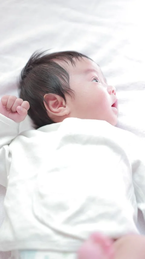 The baby boy sleeping on the bed Stock Footage 327847862