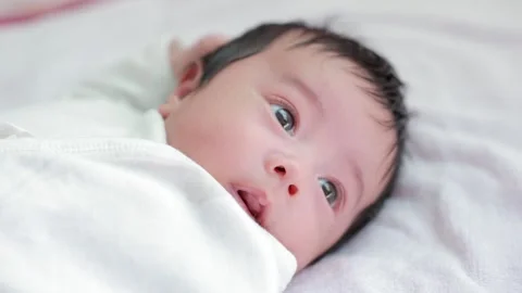 The baby boy sleeping on the bed Stock Footage 327848015