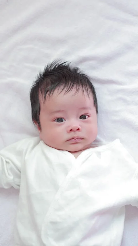 The baby boy sleeping on the bed Stock Footage 327848033