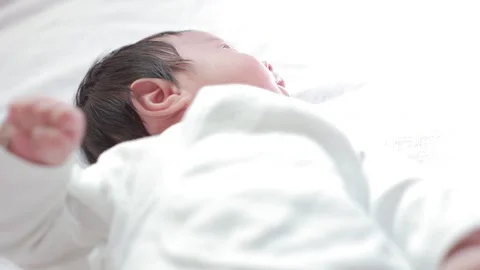 The baby boy sleeping on the bed Stock Footage 327848041