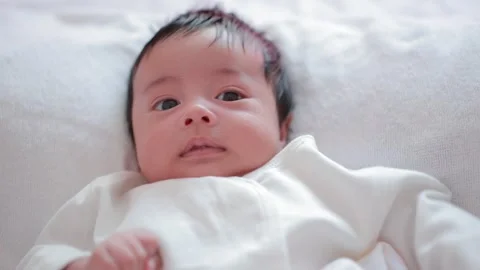 The baby boy sleeping on the bed Stock Footage 327848163