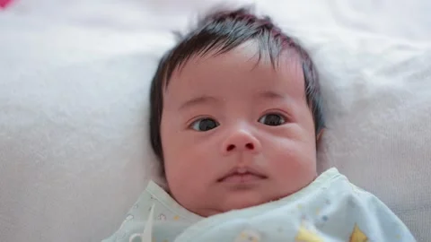 The baby boy sleeping on the bed Stock Footage 327848277